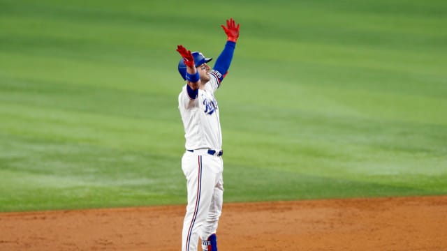 Oct 10, 2023; Arlington, Texas, USA; Texas Rangers catcher Mitch Garver (18) celebrates after hitting a two run double in the second inning against the Baltimore Orioles during game three of the ALDS for the 2023 MLB playoffs at Globe Life Field. Mandatory Credit: Andrew Dieb-USA TODAY Sports