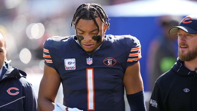 Bears quarterback Justin Fields walks to the locker room after being sacked by the Vikings.