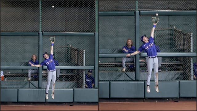 Texas Rangers left fielder Evan Carter makes a catch at the wall during the eighth inning of ALCS Game 1 against the Houston Astros Sunday night to start a double play at Minute Maid Park