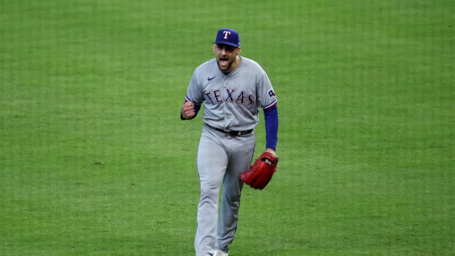 Texas Rangers starting pitcher Nathan Eovaldi reacts after escaping a bases-loaded jam with no outs in the fifth inning against the Houston Astros during Game 2 of the ALCS Monday at Minute Maid Park.