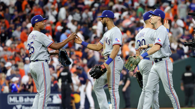 Oct 16, 2023; Houston, Texas, USA; Texas Rangers center fielder Leody Taveras (3) and relief pitcher Jose Leclerc (25) celebrate with teammates after defeating the Houston Astros in game two of the ALCS for the 2023 MLB playoffs at Minute Maid Park. Mandatory Credit: Thomas Shea-USA TODAY Sports