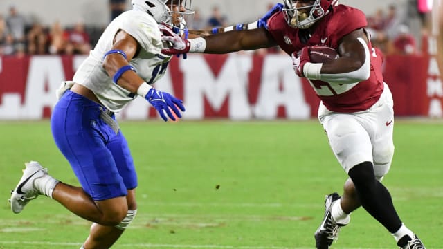 Alabama Crimson Tide running back Justice Haynes (22) runs against Middle Tennessee Blue Raiders safety Tra Fluellen (17) during the second half at Bryant-Denny Stadium. Alabama won 56-7.