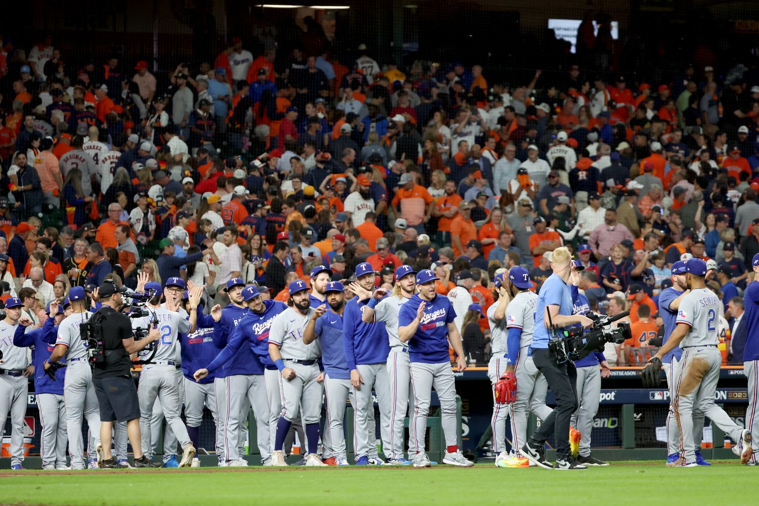 Oct 16, 2023; Houston, Texas, USA; The Texas Rangers celebrate after defeating the Houston Astros in game two of the ALCS for the 2023 MLB playoffs at Minute Maid Park. Mandatory Credit: Thomas Shea-USA TODAY Sports