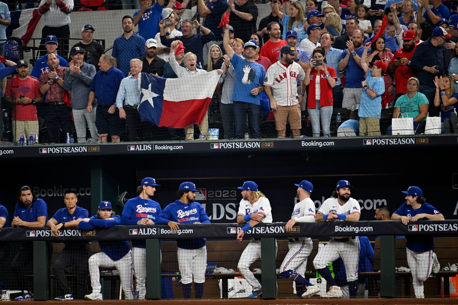 Texas Rangers fans celebrate during the team's Game 3 win over the Baltimore Orioles on Oct. 10 at Globe Life Field. Rangers players hope fans at ALCS Game 3 Wednesday are as loud as Philadelphia Phillies fans have been during postseason games at Citizens Bank Park.