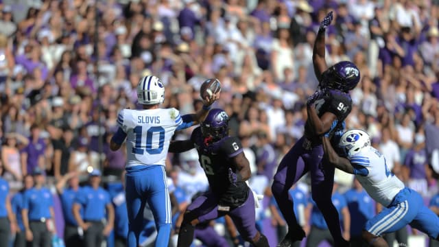 TCU's defense blocks a pass by BYU's Kedon Slovis