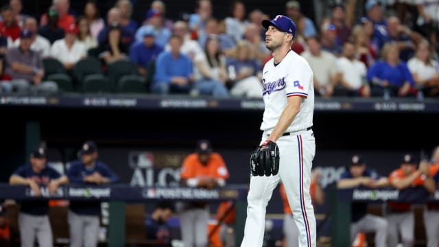 Oct 18, 2023; Arlington, Texas, USA; Texas Rangers pitcher Max Scherzer (31) reacts after a play in the first inning of game three of the ALCS against the Houston Astros in the 2023 MLB playoffs at Globe Life Field. Mandatory Credit: Kevin Jairaj-USA TODAY Sports