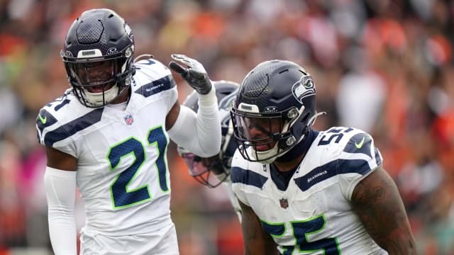 Seattle Seahawks defensive end Dre'Mont Jones (55) is congratulated bySeattle Seahawks cornerback Devon Witherspoon (21) after a sack in the third quarter during an NFL football game between the Seattle Seahawks and the Cincinnati Bengals Sunday, Oct. 15, 2023, at Paycor Stadium in Cincinnati.