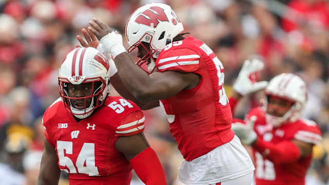 Wisconsin linebackers Jordan Turner and Maema Njongmeta (55) celebrate after Turner sacks Iowa quarterback Deacon Hill on Saturday, October 14, 2023, at Camp Randall Stadium in Madison, Wis. Iowa won the game, 12-6.