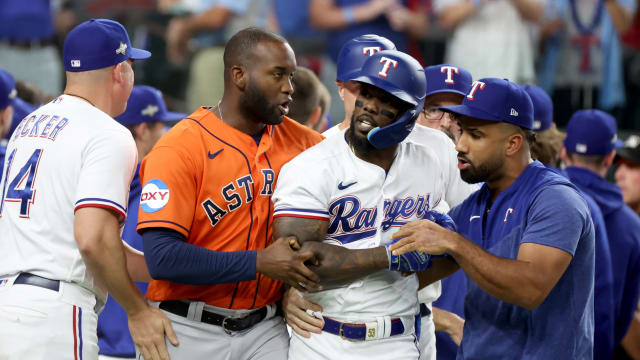 Oct 20, 2023; Arlington, Texas, USA; Texas Rangers right fielder Adolis Garcia (53) is held back by Houston Astros left fielder Yordan Alvarez (44) after being hit by a pitch during the eighth inning of game five in the ALCS for the 2023 MLB playoffs at Globe Life Field. Mandatory Credit: Kevin Jairaj-USA TODAY Sports