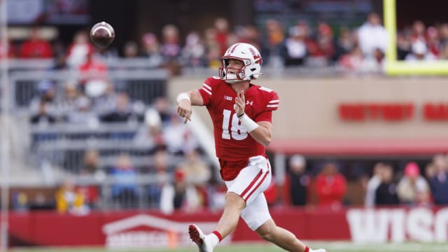 Oct 14, 2023; Madison, Wisconsin, USA; Wisconsin Badgers quarterback Braedyn Locke (18) throws a pass during the third quarter against the Iowa Hawkeyes at Camp Randall Stadium. Mandatory Credit: Jeff Hanisch-USA TODAY Sports