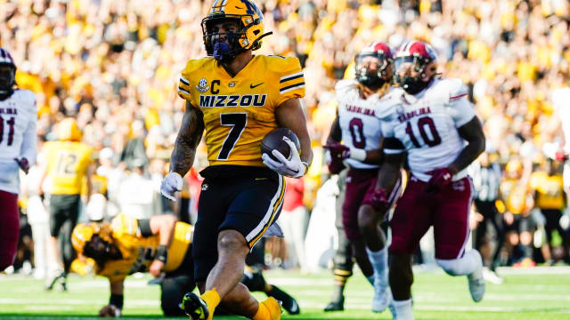Oct 21, 2023; Columbia, Missouri, USA; Missouri Tigers running back Cody Schrader (7) scores a touchdown against the South Carolina Gamecocks during the first half at Faurot Field at Memorial Stadium. Mandatory Credit: Jay Biggerstaff-USA TODAY Sports