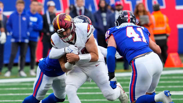 Oct 22, 2023; East Rutherford, New Jersey, USA; Washington Commanders quarterback Sam Howell (14) runs the ball against the New Giants in the second half at MetLife Stadium.