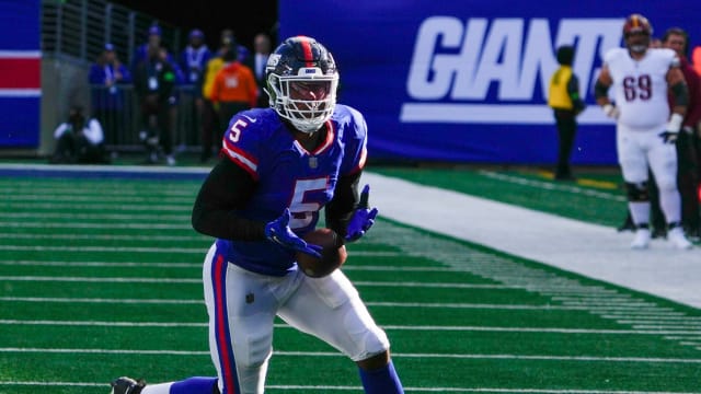 Oct 22, 2023; East Rutherford, New Jersey, USA; New York Giants linebacker Kayvon Thibodeaux (5) fumbles the ball against the Commanders in the second half at MetLife Stadium.