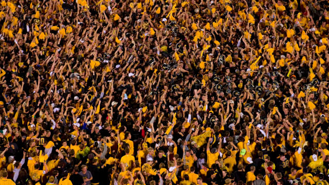 Missouri Tigers players and fans celebrate their win over the Oklahoma Sooners at Faurot Field at Memorial Stadium. The Tigers defeated the Sooners 36-27.