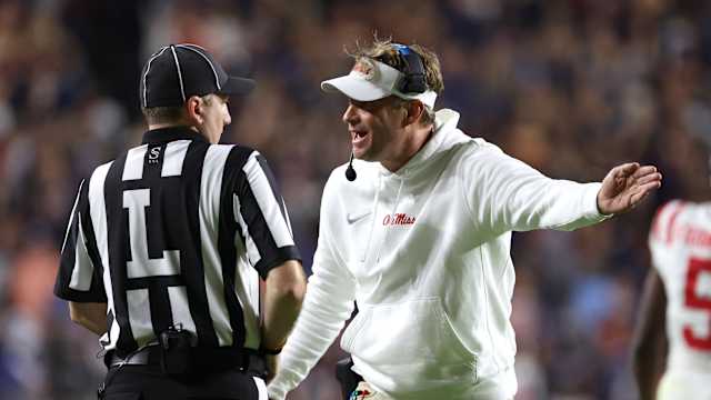 Oct 21, 2023; Auburn, Alabama, USA; Mississippi Rebels head coach Lane Kiffin talks to a game official during the second quarter against the Auburn Tigers at Jordan-Hare Stadium. Mandatory Credit: John Reed-USA TODAY Sports