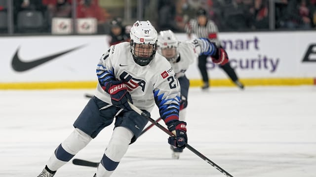Nov 21, 2021; Kingston, Ontario, CAN; USA forward Britta Curl (27) tries to control a puck against Canada during the first period in a Rivalry Series women's hockey game at Leon's Centre. Mandatory Credit: John E. Sokolowski-USA TODAY Sports