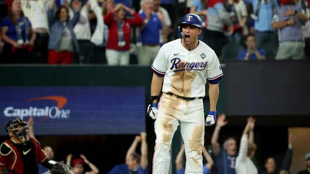 Oct 27, 2023; Arlington, TX, USA; Texas Rangers shortstop Corey Seager (5) hits a two-run home during the ninth inning in game one of the 2023 World Series against the Arizona Diamondbacks at Globe Life Field. Mandatory Credit: Kevin Jairaj-USA TODAY Sports