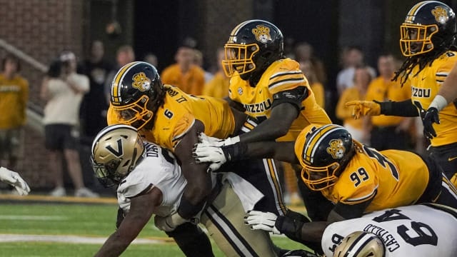 Missouri Tigers defensive lineman Darius Robinson (6) makes a key stop short of the first down on Vanderbilt's final drive during the second half of the game at Faurot Field at Memorial Stadium in 2022.