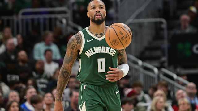 Milwaukee Bucks guard Damian Lillard (0) brings the ball down court