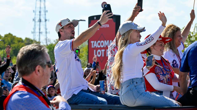 Nov 3, 2023; Arlington, TX, USA; Texas Rangers center fielder Evan Carter (32) during the World Series championship parade at Globe Life Field. Mandatory Credit: Jerome Miron-USA TODAY Sports