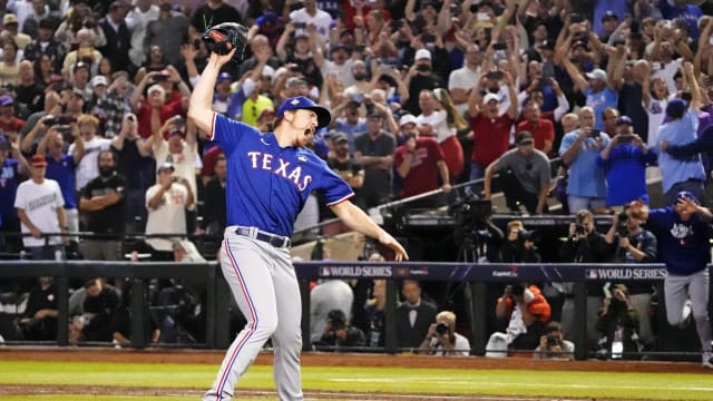 Texas Rangers relief pitcher Josh Sborz celebrates the final out of the club's first World Series championship by slamming his globe into the field turf at Chase Field in Phoenix on Nov. 1. The Rangers beat the Arizona Diamondbacks 5-0 to win the series 4-1.
