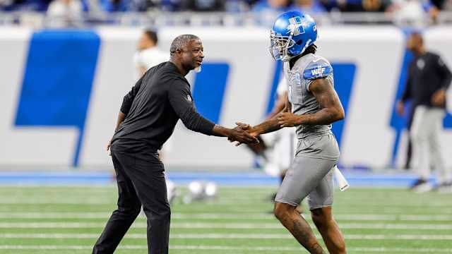 Detroit Lions defensive coordinator Aaron Glenn greets Cam Sutton