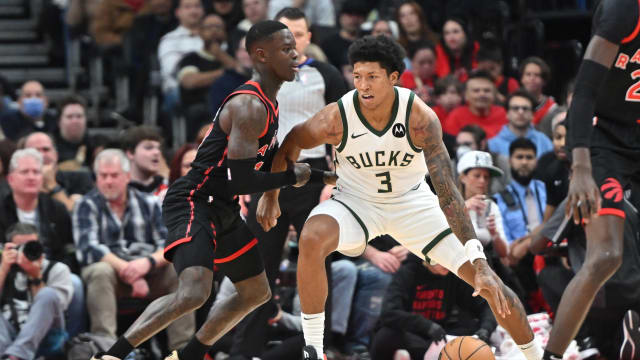 Milwaukee Bucks guard MarJon Beauchamp (3) dribbles the ball as Toronto Raptors guard Dennis Schroder (17)