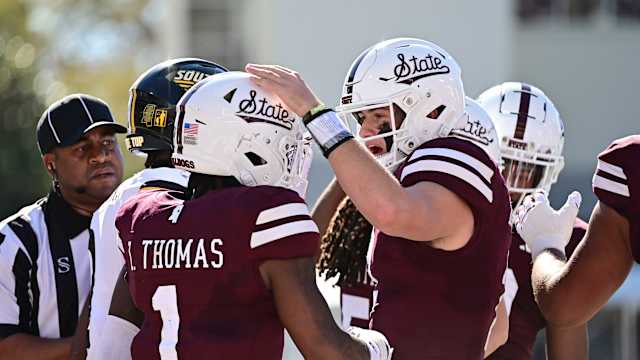 Nov 18, 2023; Starkville, Mississippi, USA; Mississippi State Bulldogs quarterback Will Rogers (2) reacts with wide receiver Zavion Thomas (1) after a touchdown against the Southern Miss Golden Eagles at Davis Wade Stadium at Scott Field. Mandatory Credit: Matt Bush-USA TODAY Sports