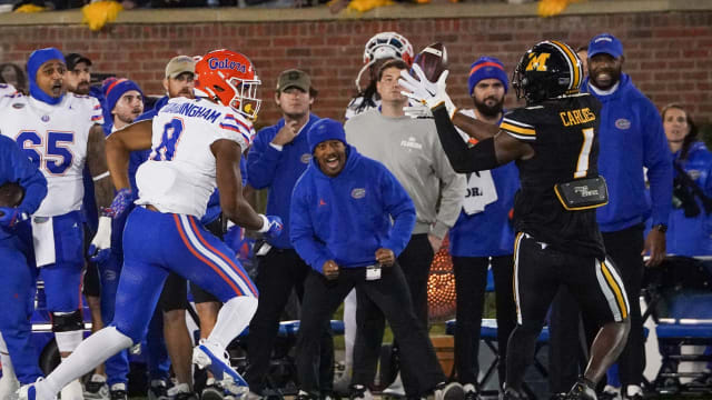 Missouri Tigers defensive back JC Carlies (1) intercepts a pass intended for Florida Gators tight end Arlis Boardingham (8) during the first half at Faurot Field at Memorial Stadium.