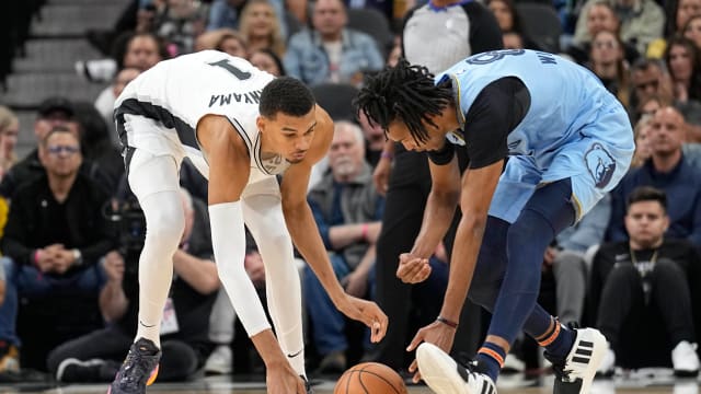 Nov 18, 2023; San Antonio, Texas, USA; Memphis Grizzlies forward Ziaire Williams (8) and San Antonio Spurs forward Victor Wembanyama (1) battle for a loose ball during the second half at Frost Bank Center.