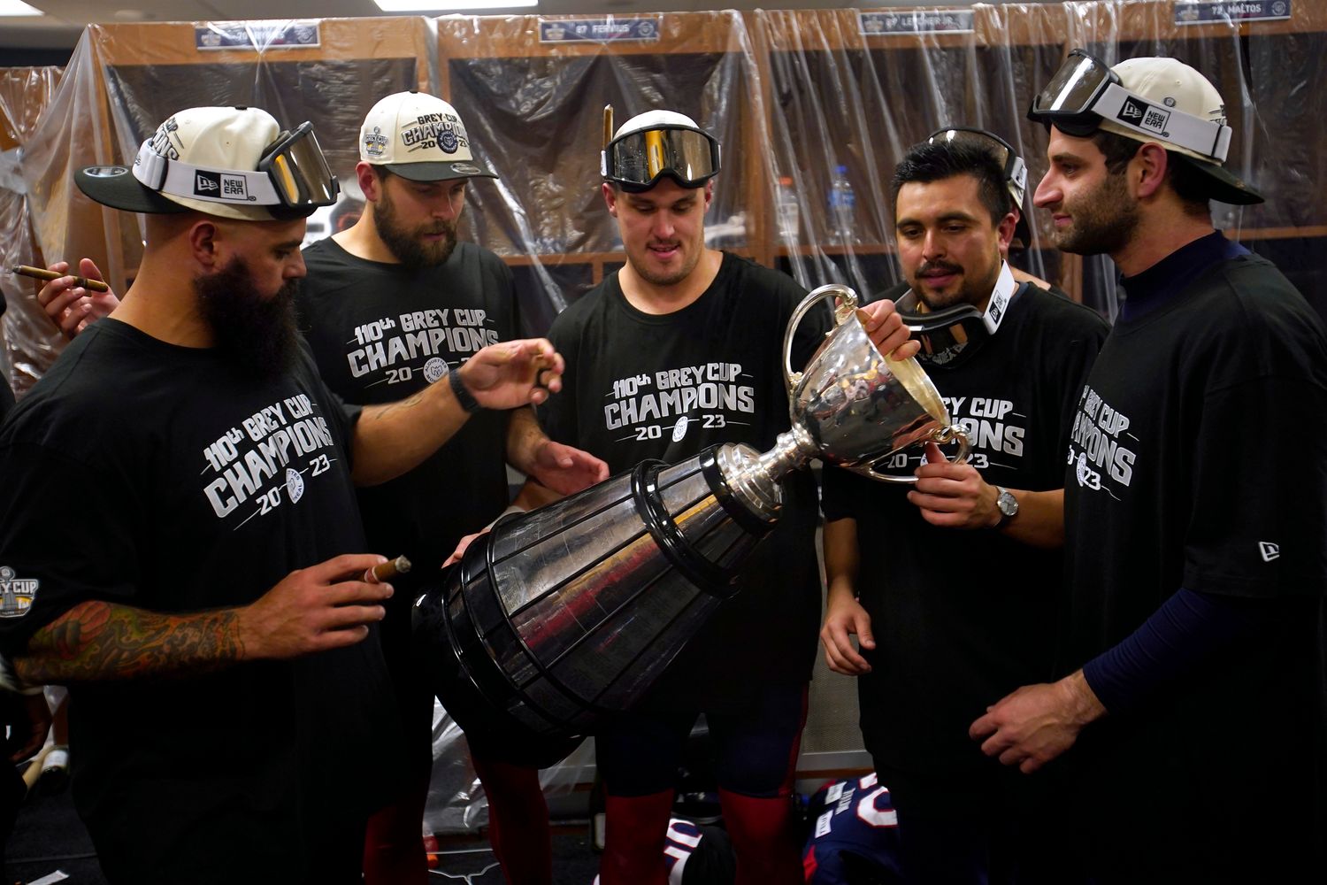 Nov 19, 2023; Hamilton, Ontario, CAN; Montreal Alouettes look at the Grey Cup after winning the 110th Grey Cup against the Winnipeg Blue Bombers at Tim Hortons Field. Mandatory Credit: John E. Sokolowski-USA TODAY Sports