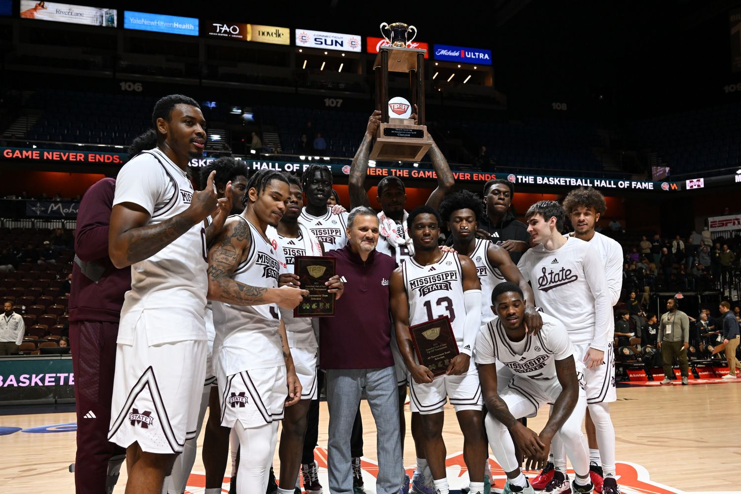 Mississippi State Bulldogs lifts the trophy and celebrates the win against Northwestern Wildcats at Mohegan Sun Arena.