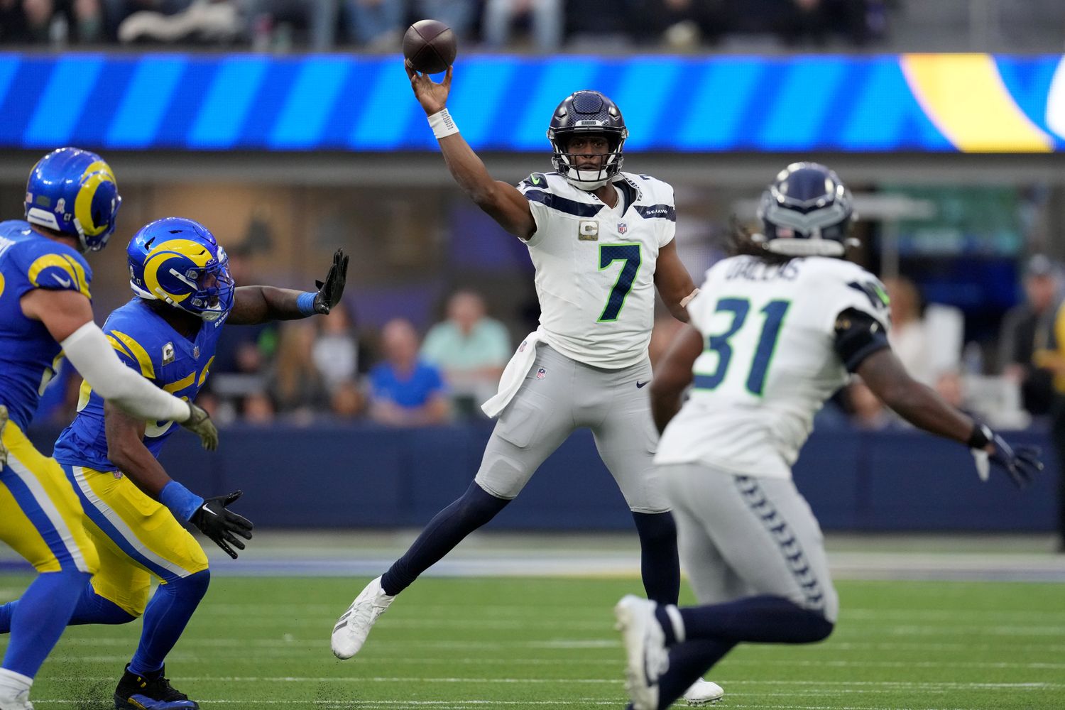 Seattle Seahawks quarterback Geno Smith (7) throws a pass against the Los Angeles Rams in the third quarter at SoFi Stadium.