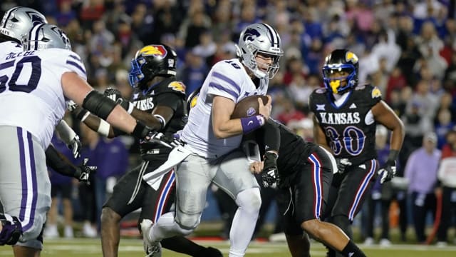 Nov 18, 2023; Lawrence, Kansas, USA; Kansas State Wildcats quarterback Will Howard (18) runs the ball for a two point conversion against the Kansas Jayhawks during the second half at David Booth Kansas Memorial Stadium. M