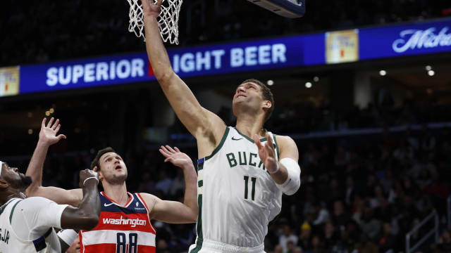 Milwaukee Bucks center Brook Lopez (11) shoots the ball as Washington Wizards forward Danilo Gallinari (88) 