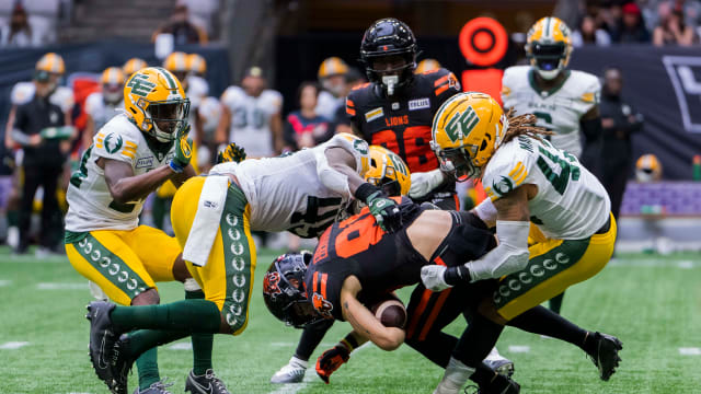 Jun 17, 2023; Vancouver, British Columbia, CAN; Edmonton Elks linebacker Nyles Morgan (45) and linebacker Enock Makonzo (43) tackle BC Lions receiver Ayden Eberhardt (80) in the second half at BC Place. BC won 22-0. Mandatory Credit: Bob Frid-USA TODAY Sports