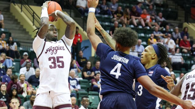 Nov 23, 2023; Kissimmee, FL, USA; Texas A&M Aggies guard Manny Obaseki (35) shoots the ball over Penn State Nittany Lions forward Puff Johnson (4) in the second half during the ESPN Events Invitational at State Farm Field House.