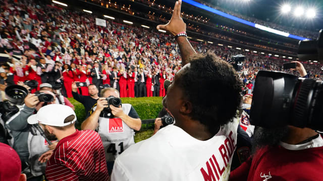 Nov 25, 2023; Auburn, Alabama, USA; Alabama Crimson Tide quarterback Jalen Milroe (4) celebrates as he walks off the field following their 27-24 victory over the Auburn Tigers at Jordan-Hare Stadium.
