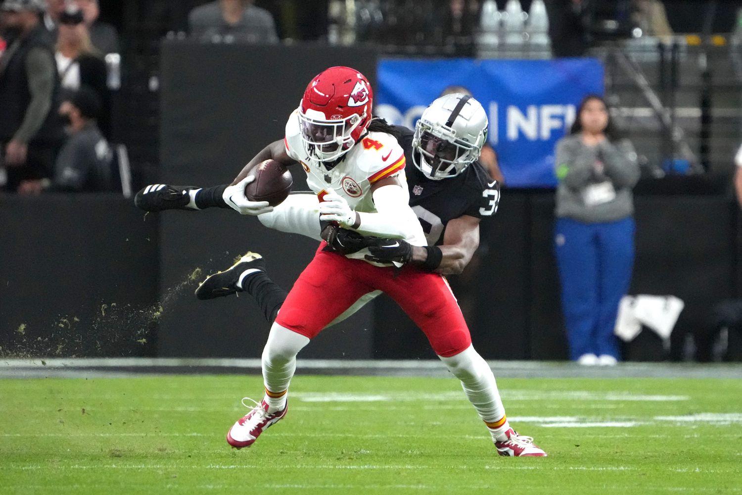 Nov 26, 2023; Paradise, Nevada, USA; Kansas City Chiefs wide receiver Rashee Rice (4) is tackled by Las Vegas Raiders cornerback Nate Hobbs (39) in the first half at Allegiant Stadium. Mandatory Credit: Kirby Lee-USA TODAY Sports  