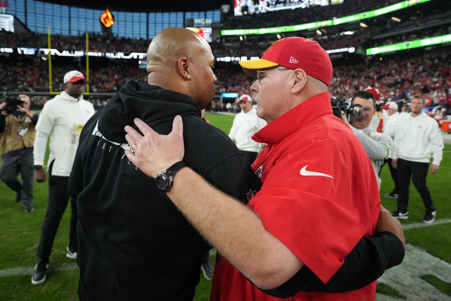 Nov 26, 2023; Paradise, Nevada, USA; Las Vegas Raiders interim coach Antonio Pierce (left) shakes hands with Kansas City Chiefs coach Andy Reid after the game at Allegiant Stadium. Mandatory Credit: Kirby Lee-USA TODAY Sports  