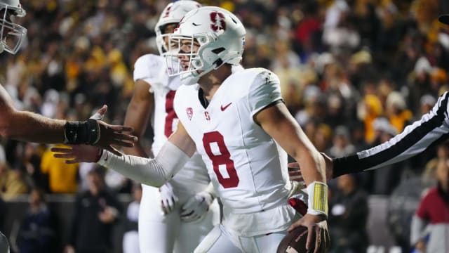 Oct 13, 2023; Boulder, Colorado, USA; Stanford Cardinal quarterback Justin Lamson (8) celebrates his 1 yard touchdown carry in the third quarter against the Colorado Buffaloes at Folsom Field. Mandatory Credit: Ron Chenoy-USA TODAY Sports