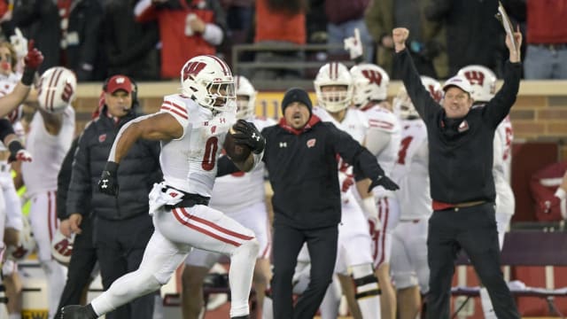 Nov 25, 2023; Minneapolis, Minnesota, USA; Wisconsin Badgers running back Braelon Allen (0) runs for 50-yards against the Minnesota Golden Gophers during the third quarter at Huntington Bank Stadium. Mandatory Credit: Nick Wosika-USA TODAY Sports