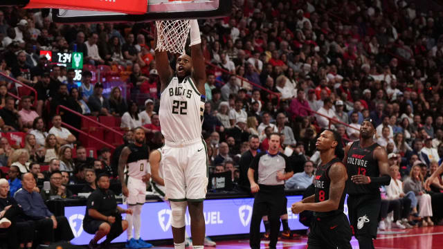 Milwaukee Bucks forward Khris Middleton (22) dunks the ball against the Miami Heat 
