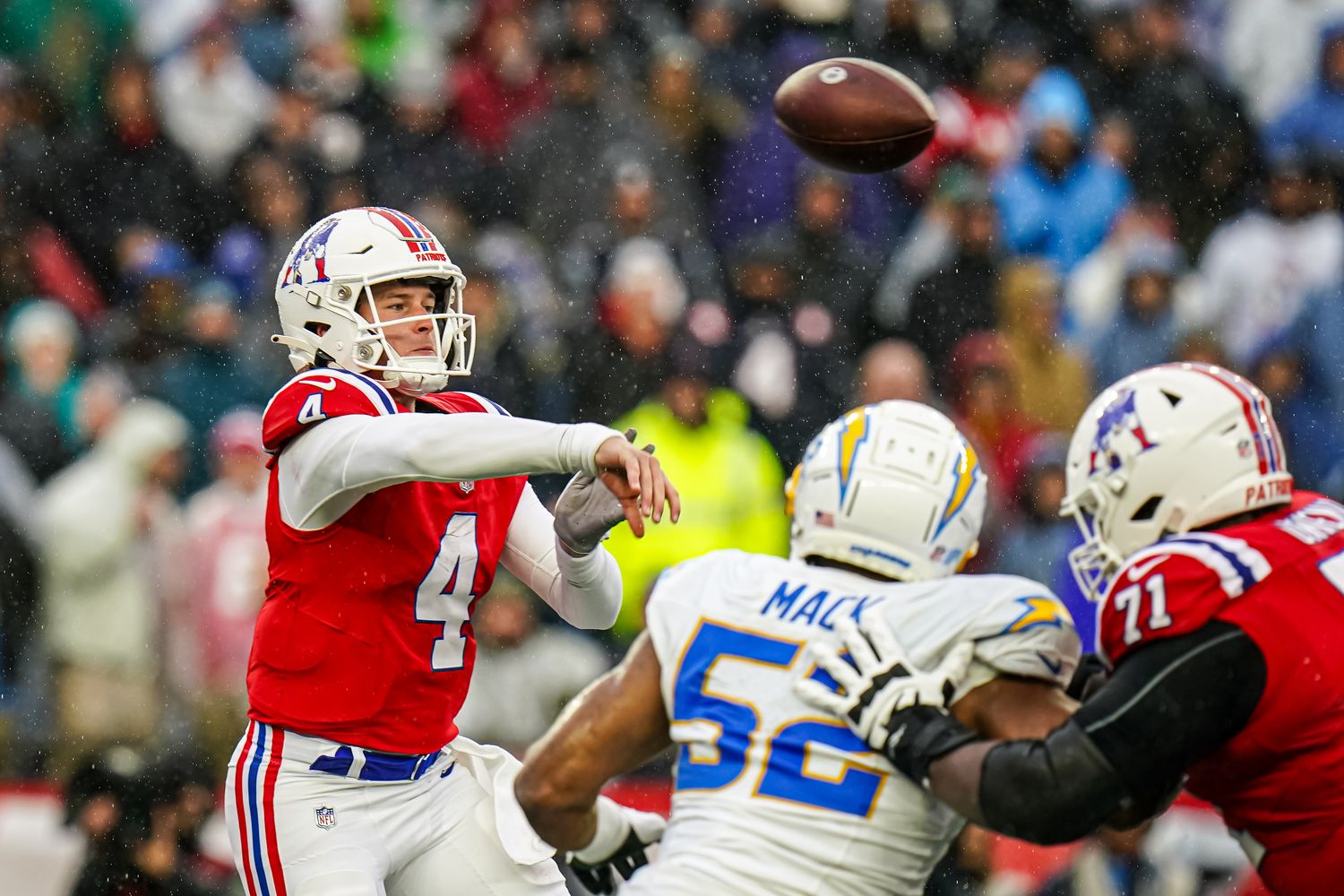 New England Patriots quarterback Bailey Zappe (4) throws a pass against the Los Angeles Chargers in the second quarter at Gillette Stadium.