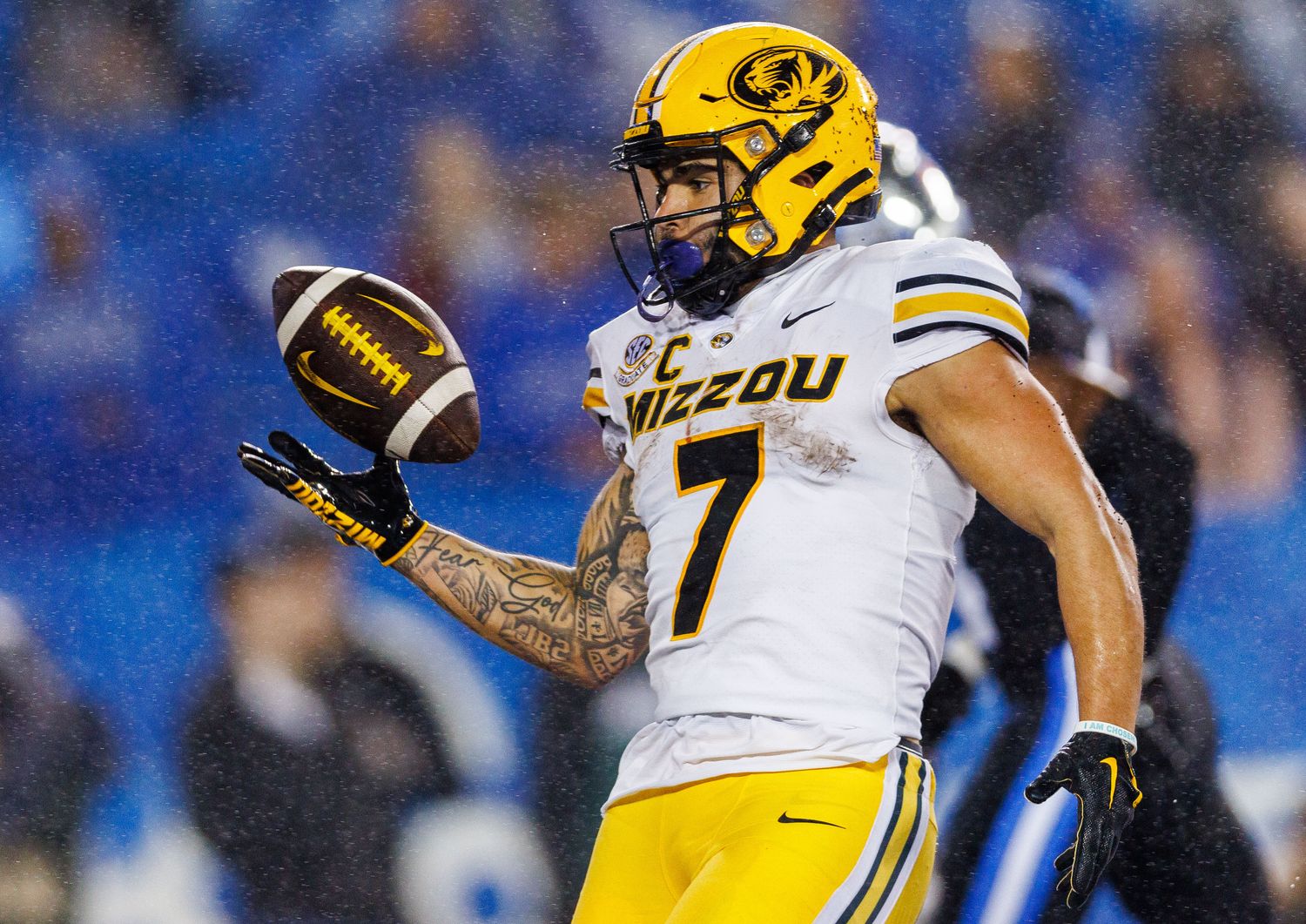Oct 14, 2023; Lexington, Kentucky, USA; Missouri Tigers running back Cody Schrader (7) tosses the ball to a referee after scoring a touchdown during the fourth quarter against the Kentucky Wildcats at Kroger Field. Mandatory Credit: Jordan Prather-USA TODAY Sports