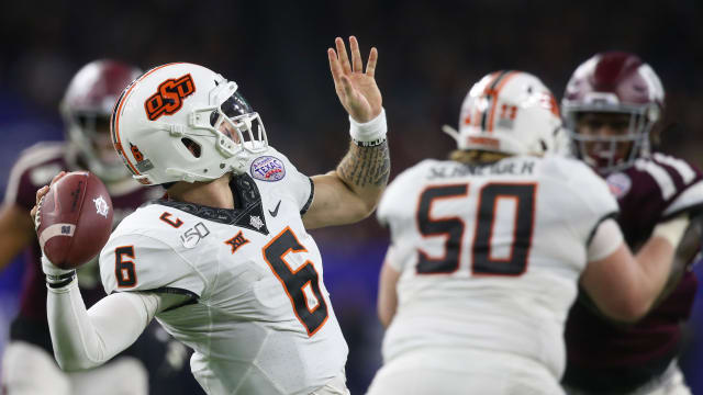 Dec 27, 2019; Houston, Texas, USA; Oklahoma State Cowboys quarterback Dru Brown (6) passes against the Texas A&M Aggies in the first half at NRG Stadium. Mandatory Credit: Thomas Shea-USA TODAY Sports