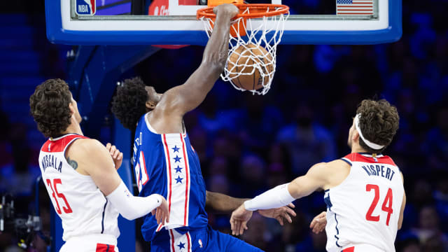Nov 6, 2023; Philadelphia, Pennsylvania, USA; Philadelphia 76ers center Joel Embiid (21) dunks the ball past Washington Wizards center Mike Muscala (35) and forward Corey Kispert (24) during the third quarter at Wells Fargo Center. Mandatory Credit: Bill Streicher-USA TODAY Sports