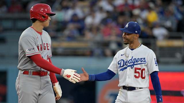 Jul 7, 2023; Los Angeles, California, USA; Los Angeles Angels starting pitcher Shohei Ohtani (17) and Los Angeles Dodgers right fielder Mookie Betts (50) talk while at second base during a play review in the fourth inning at Dodger Stadium.
