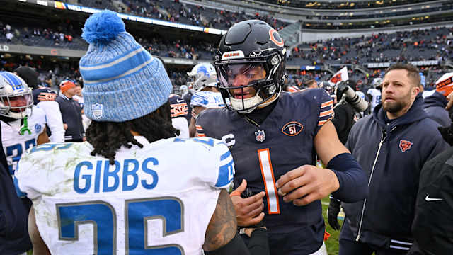 Detroit Lions running back Jahmyr Gibbs greets Bears Justin Fields