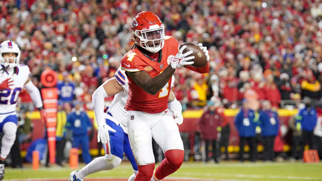 Dec 10, 2023; Kansas City, Missouri, USA; Kansas City Chiefs wide receiver Rashee Rice (4) catches a pass for a touchdown against the Buffalo Bills during the second half at GEHA Field at Arrowhead Stadium. Mandatory Credit: Denny Medley-USA TODAY Sports  